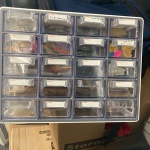 Storage container with badge reel acrylics